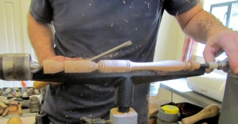 Turning one of the spindles for his third piece. A clock stand